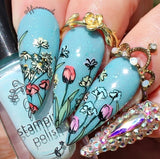 beautiful-blue-manicure-with-nail-art-designs-of-colourful-tulips-daisies-and-roses