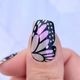 Manicure-of-a-single-thumb-nail-with-nail-art-design-of-butterfly-wing