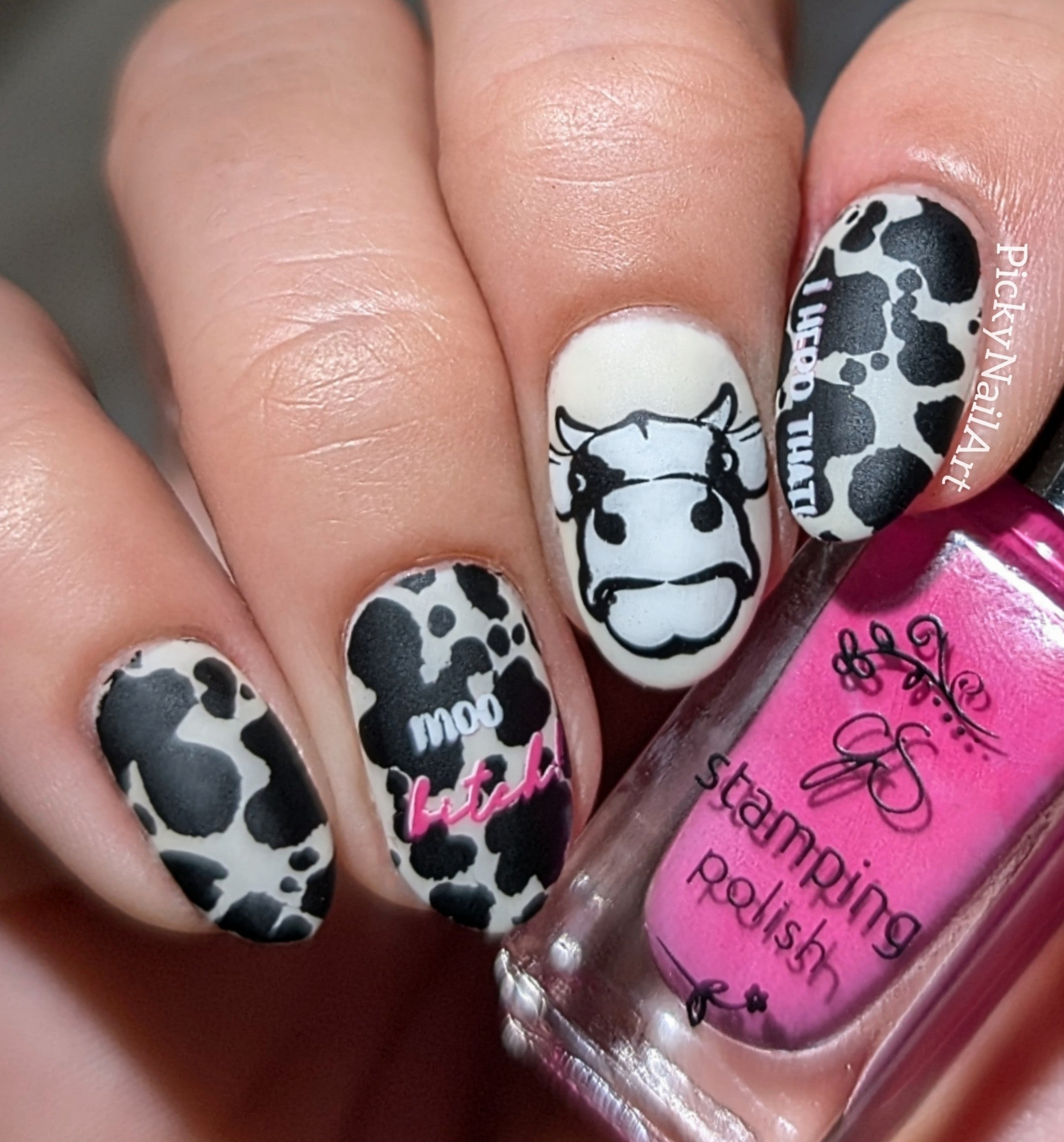stunning-manicure-with-cow-print-nail-art-designs-and-the-words-mow-bitch