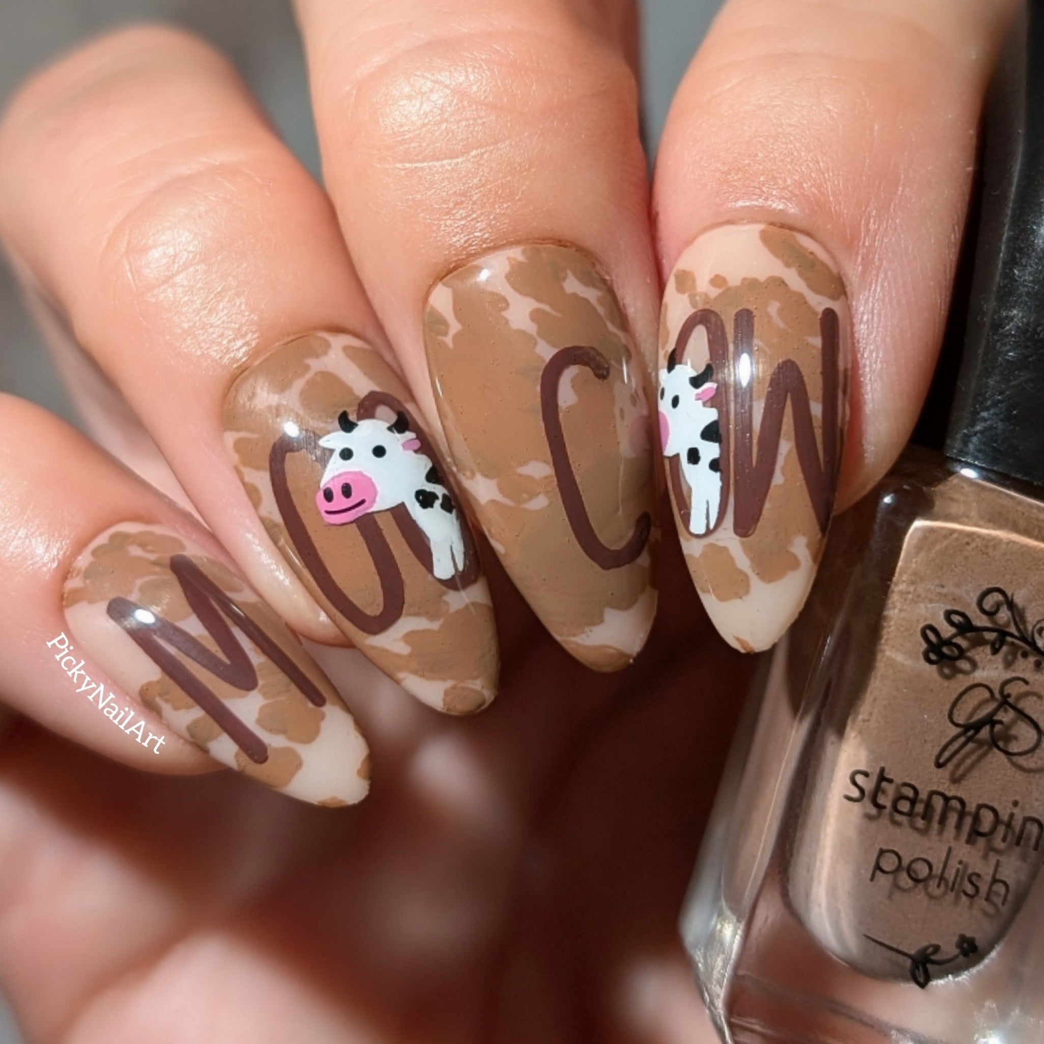 beautiful-cow-themed-manciure-with-nail-art-designs-of-cow-print-and-words-moo-cow
