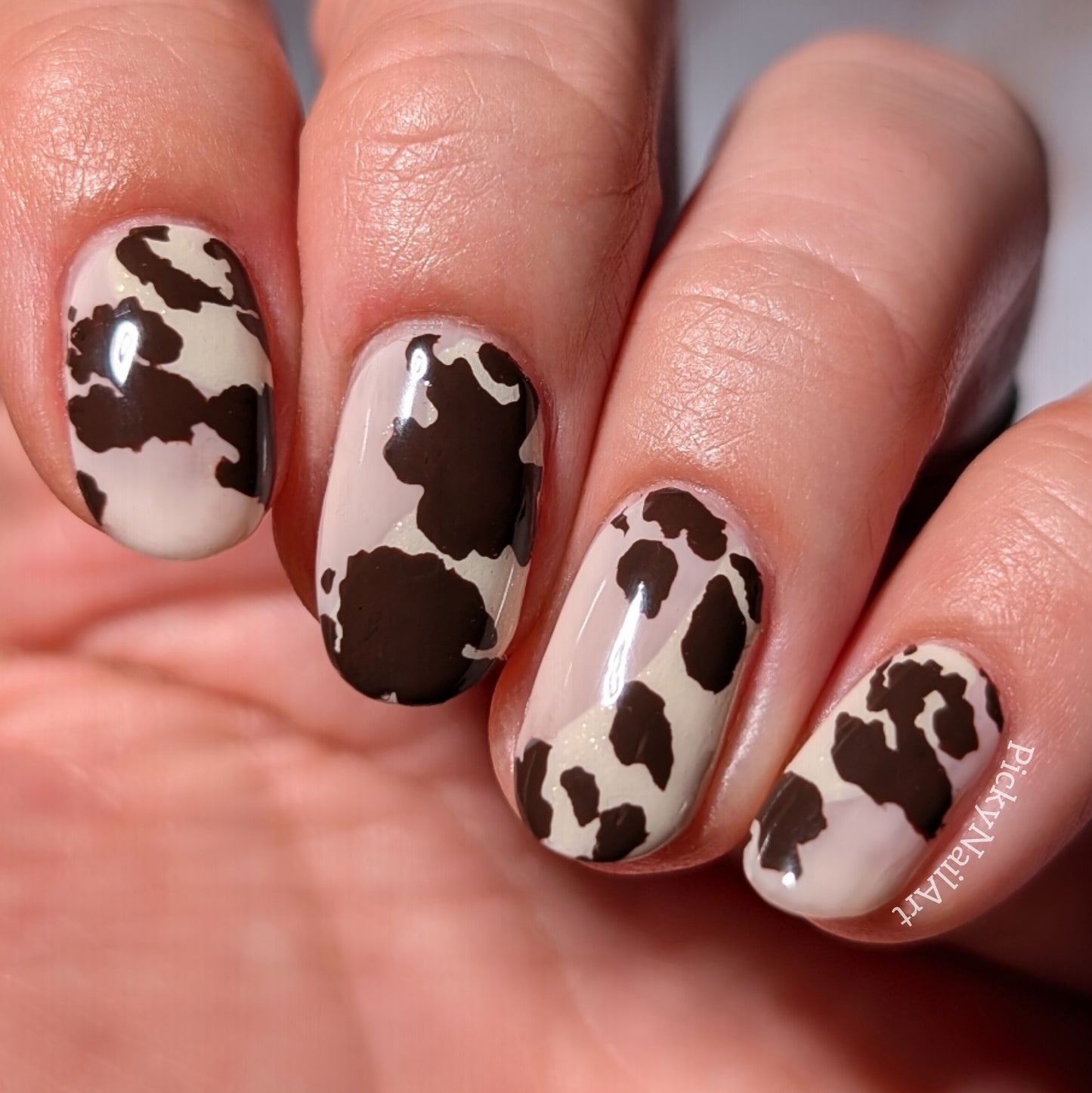 stunning-cow-print-nail-art-manicure