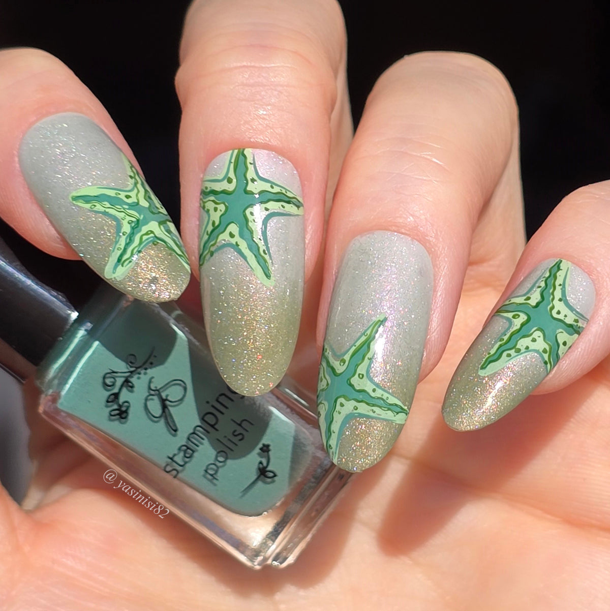 beautiful-littery-manicure-with-stamping-nail-art-designs-of-starfish