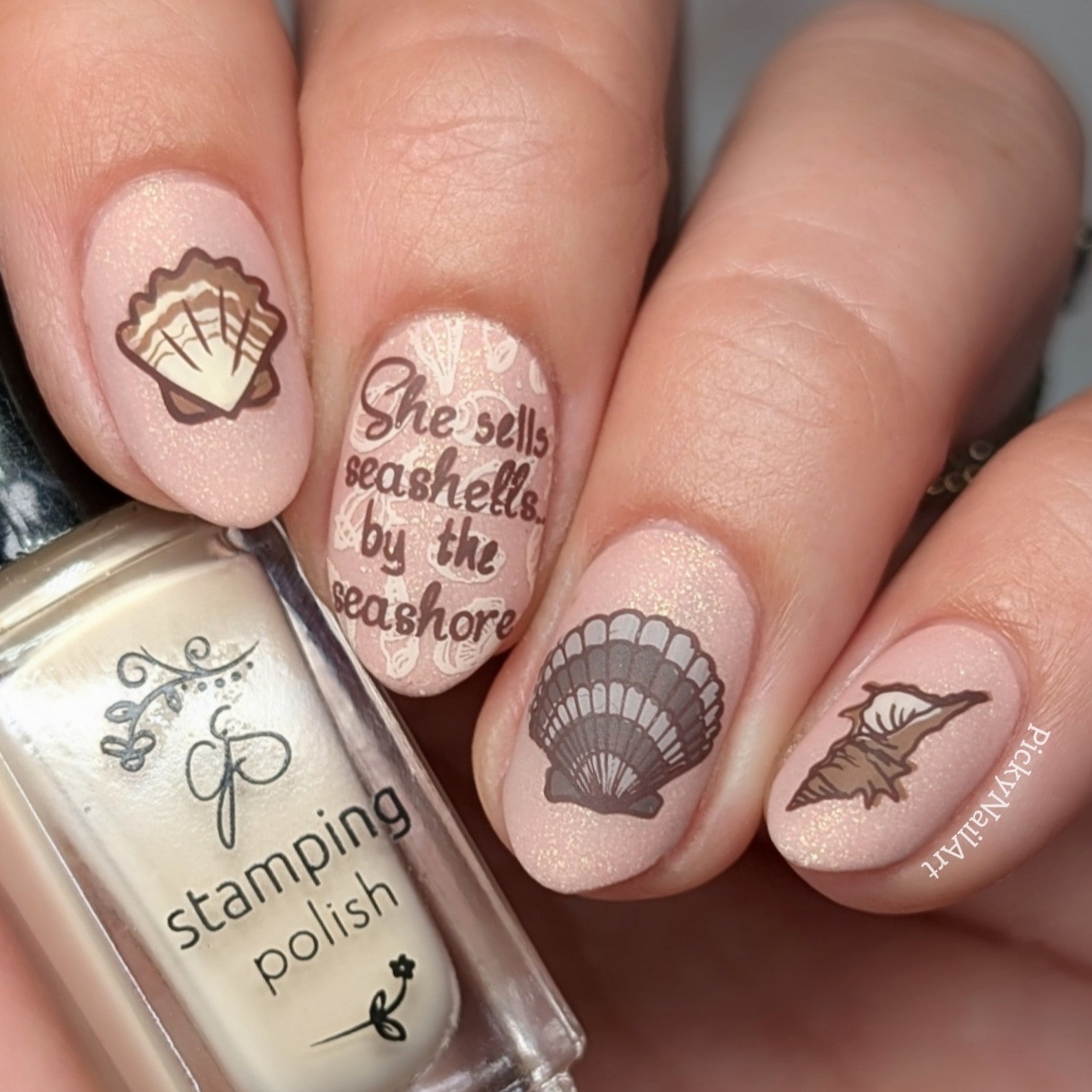 beautiful-muted-manicure-showing-nail-art-designs-of-seashells