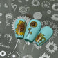 three-nail-tips-with-layered-nail-art-designs-of-sunflowers
