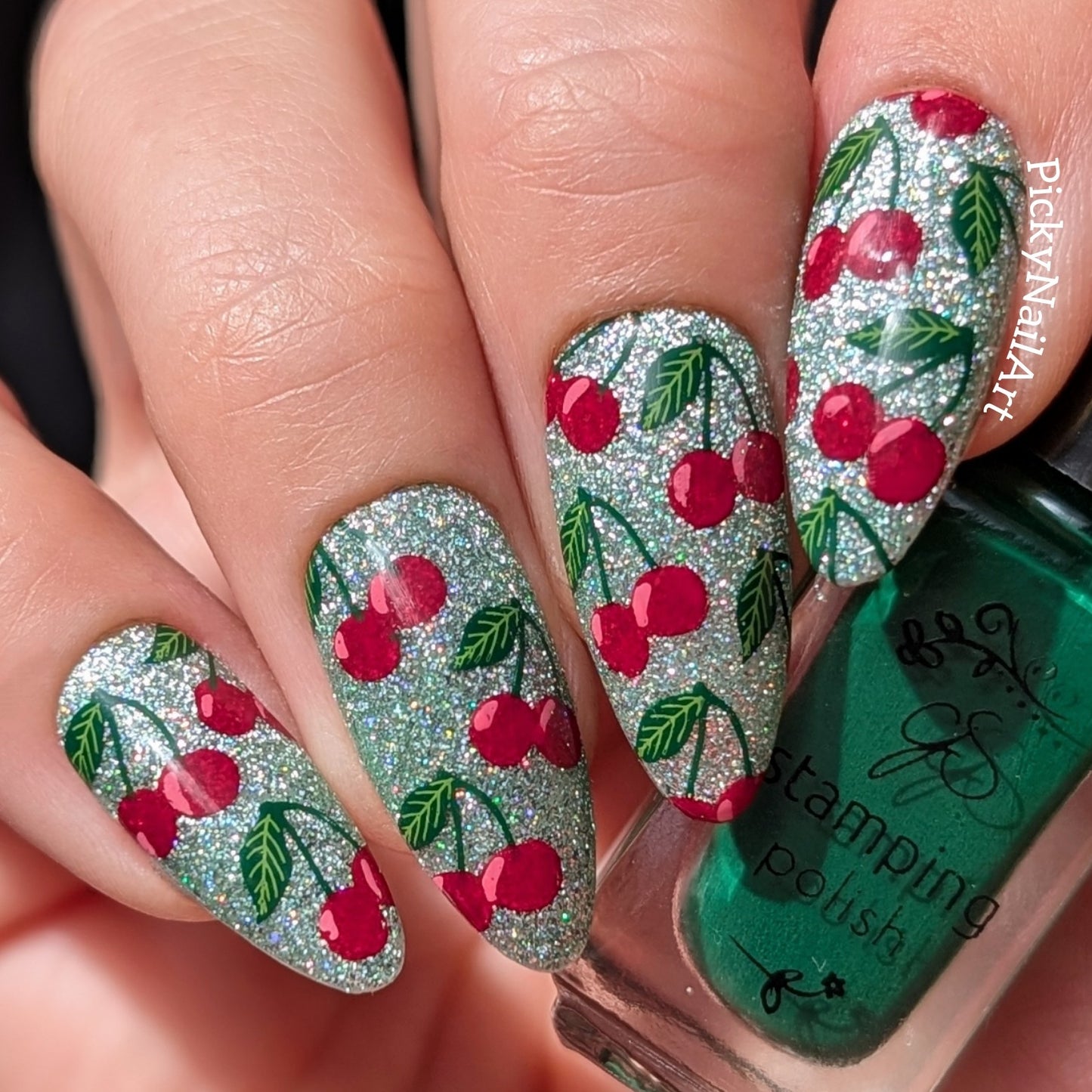 stunning-sparkle-manicured-hand-with-layered-nail-art-designs-of-pairs-of-cherries