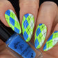 Nails with green and blue argyle pattern and a bottle of stamping polish.