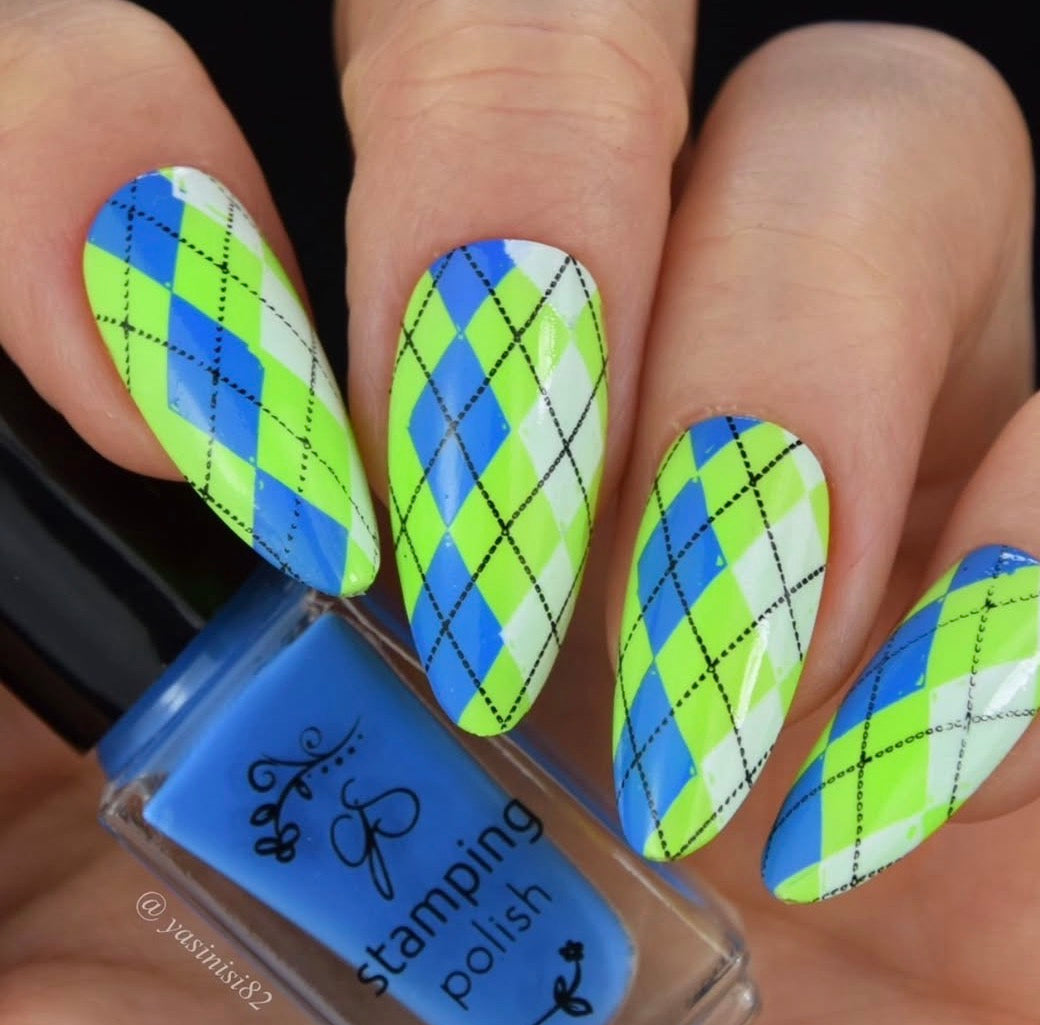 Nails with green and blue argyle pattern and a bottle of stamping polish.