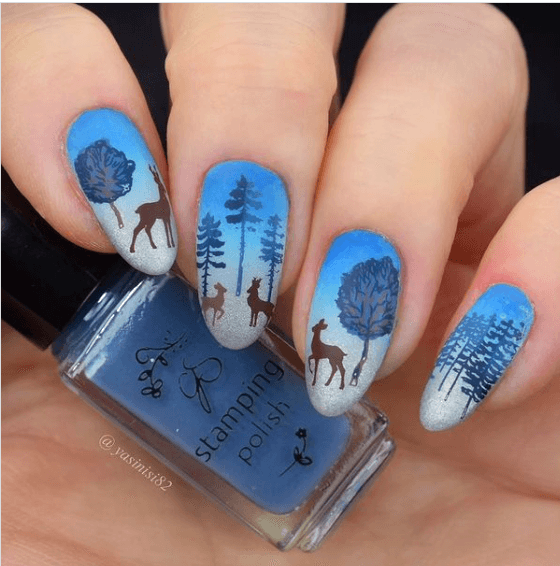 manciure-with-stunning-winter-nail-art-scene-of-snow-falling-on-deer-and-woodland-trees