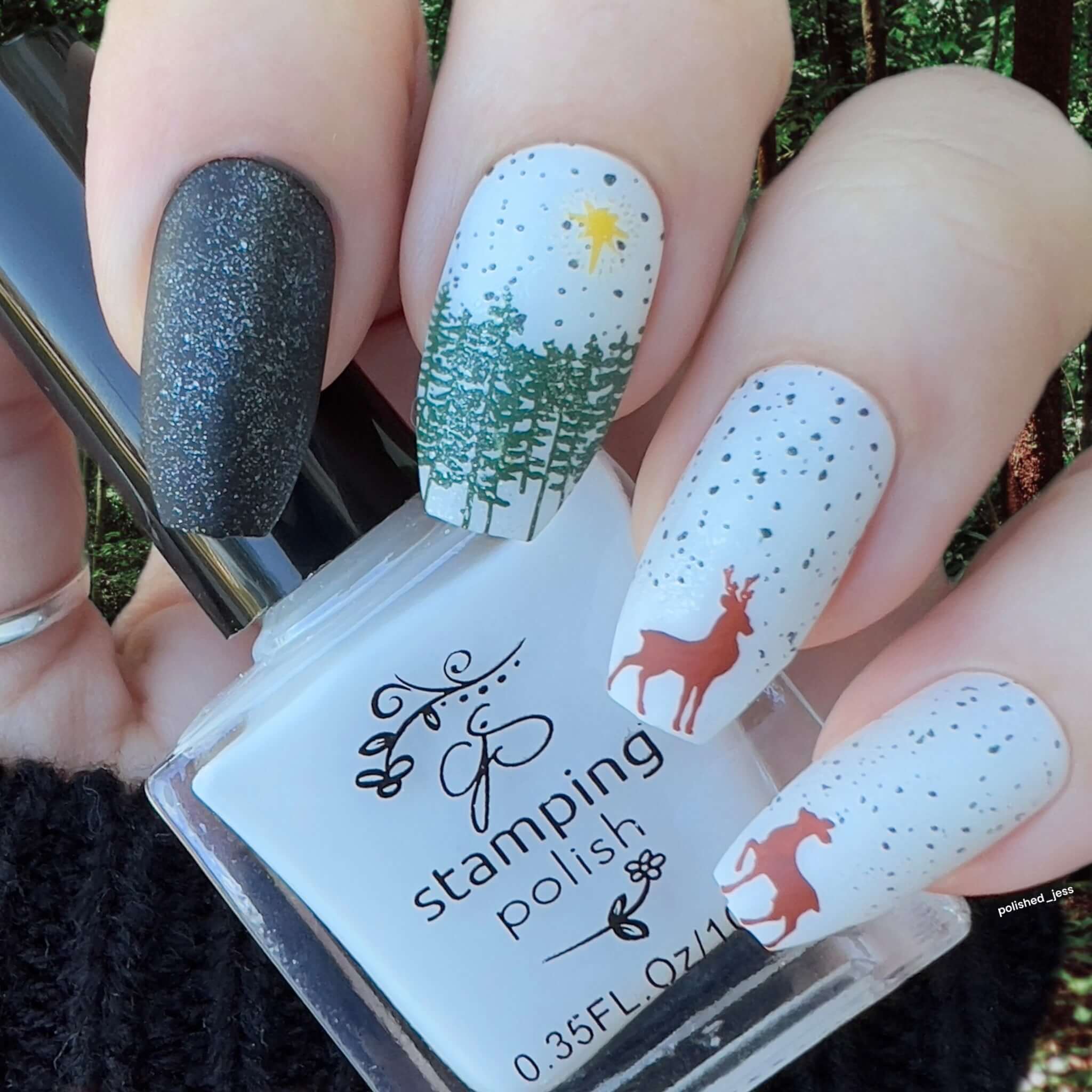 manicure-with-a-winter-nail-art-scene-of-two-deer-and-trees