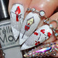 manicure-with-nail-art-scene-of-snow-a-lampost-and-a-robin-sitting-on-a-branch