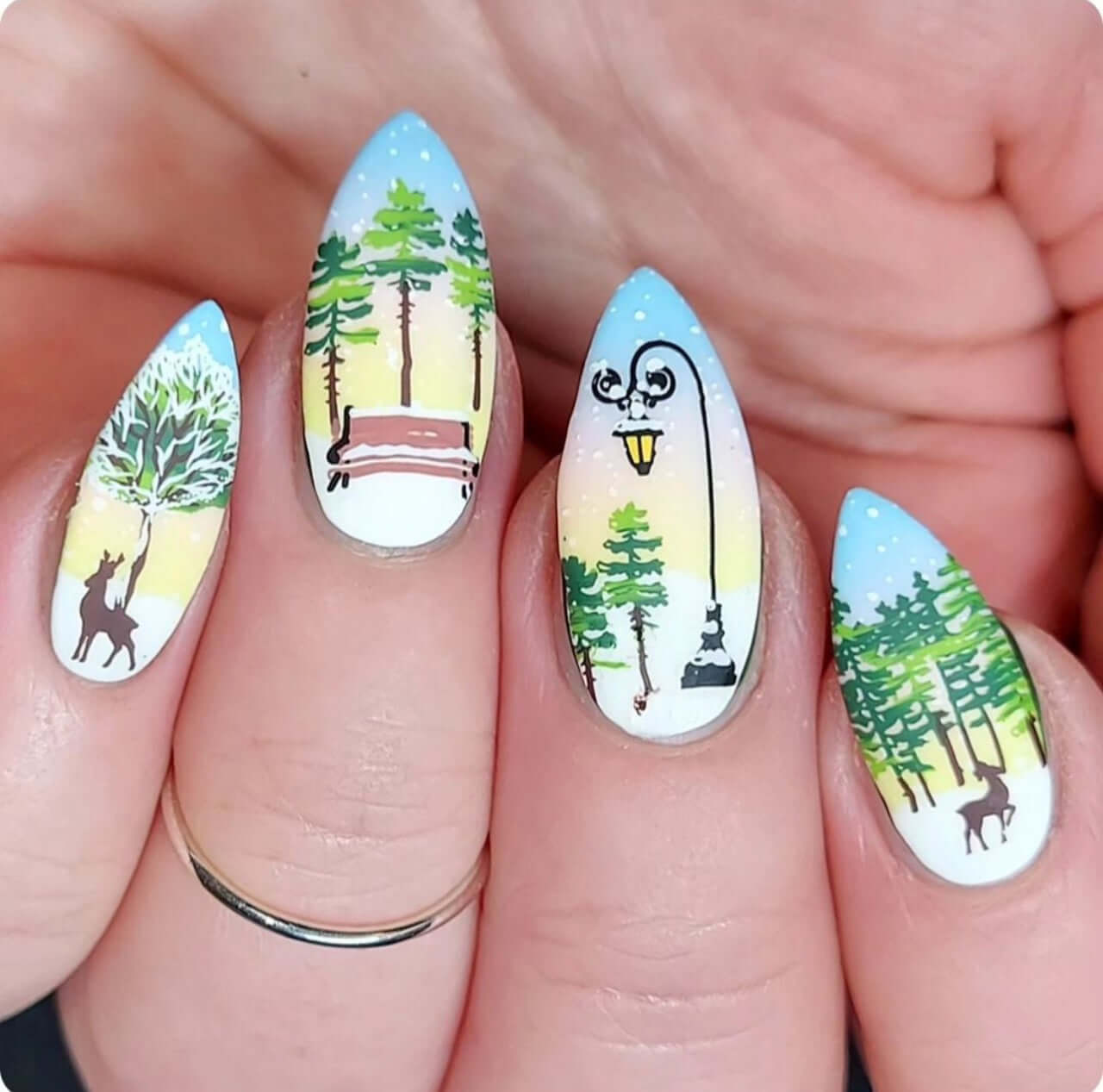 manicure-with-stunning-winter-nail-art-scene-of-snow-falling-on-deer-and-woodland-trees