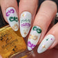 shimmery-manicure-with-nail-art-designs-of-charade-masks-and-the-words-let's-party