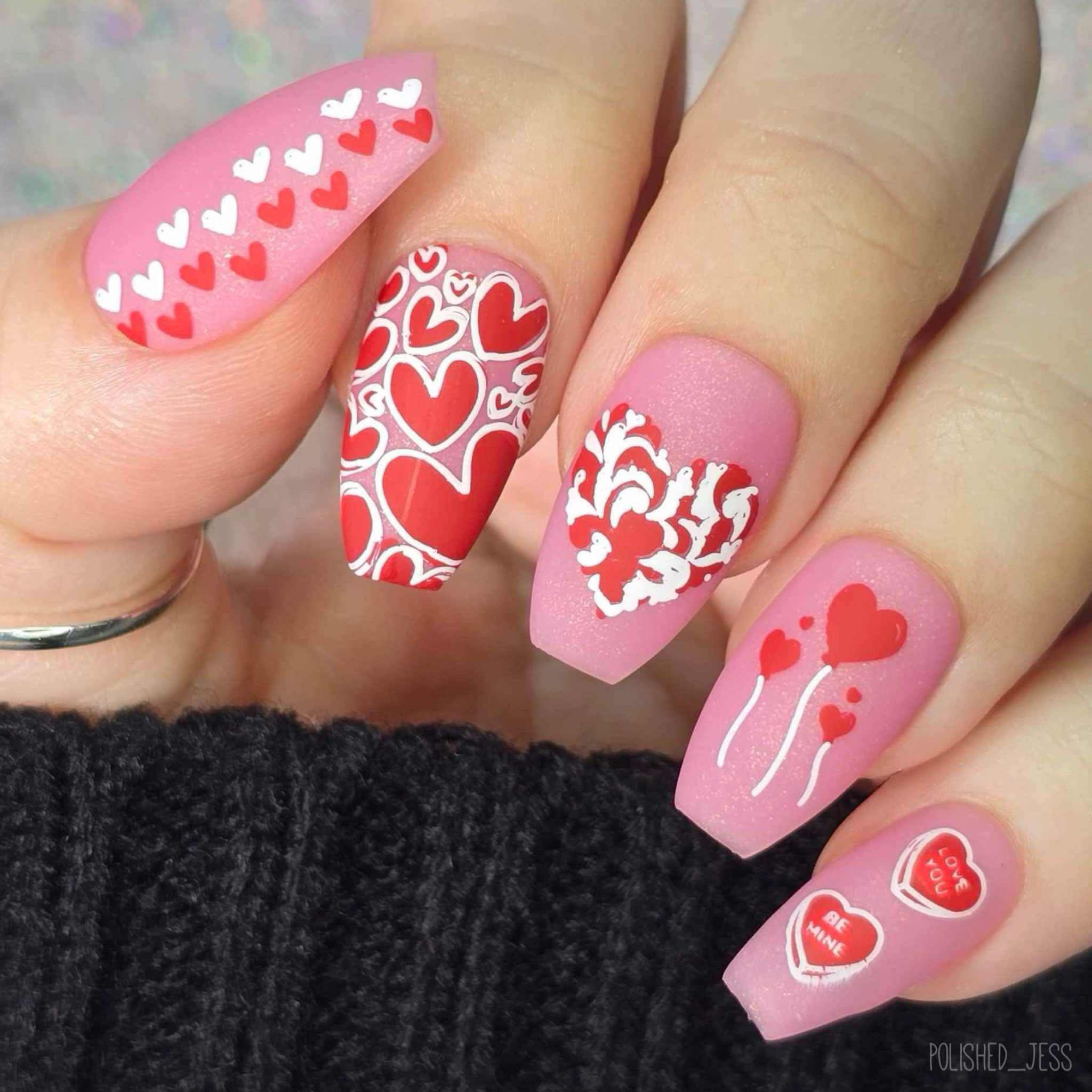 bright-maniucre-with-nail-art-designs-of-hearts-in-different-shapes-and-sizes -and-words-be-mine