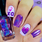manicure-showing-nail-art-designs-of-a-heart-and-letters-XO