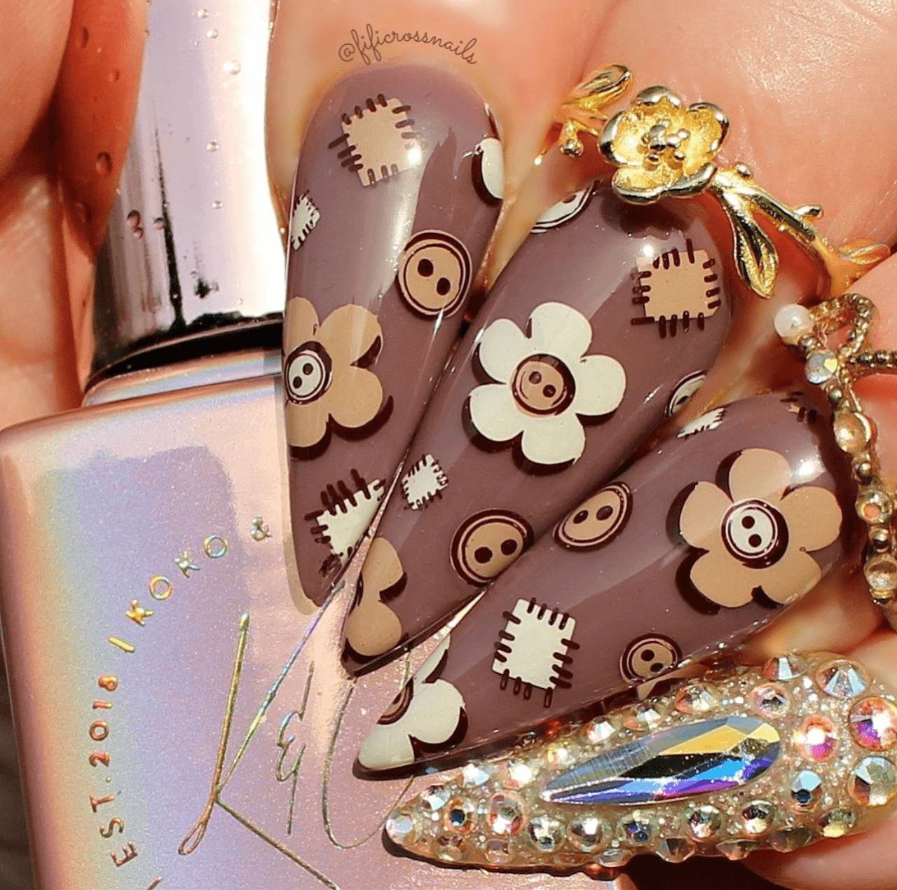 gorgeous-manicure-with-cute-nail-art-designs-of-buttons-and-smiling-flowers