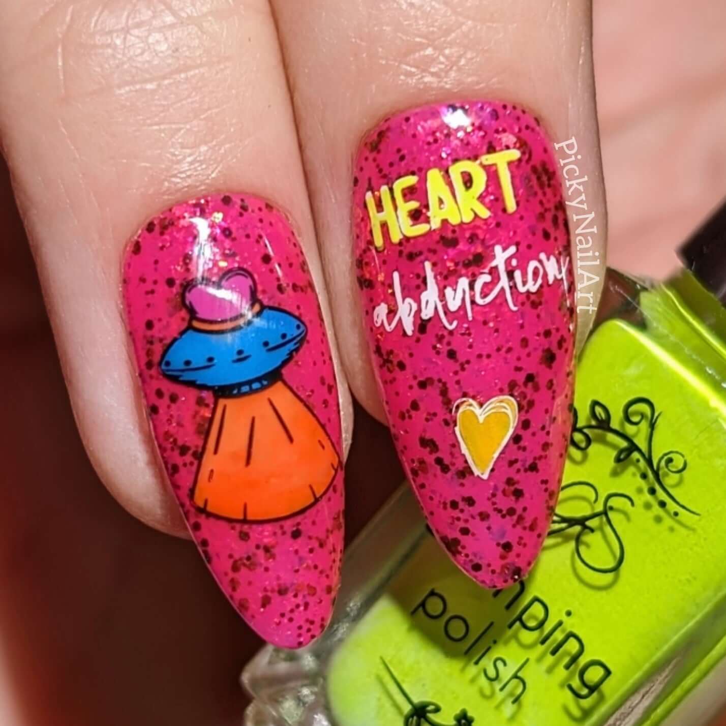 two-manciured-nails-with-bright-stamping-nail-art-designs-of-a-space-ship
