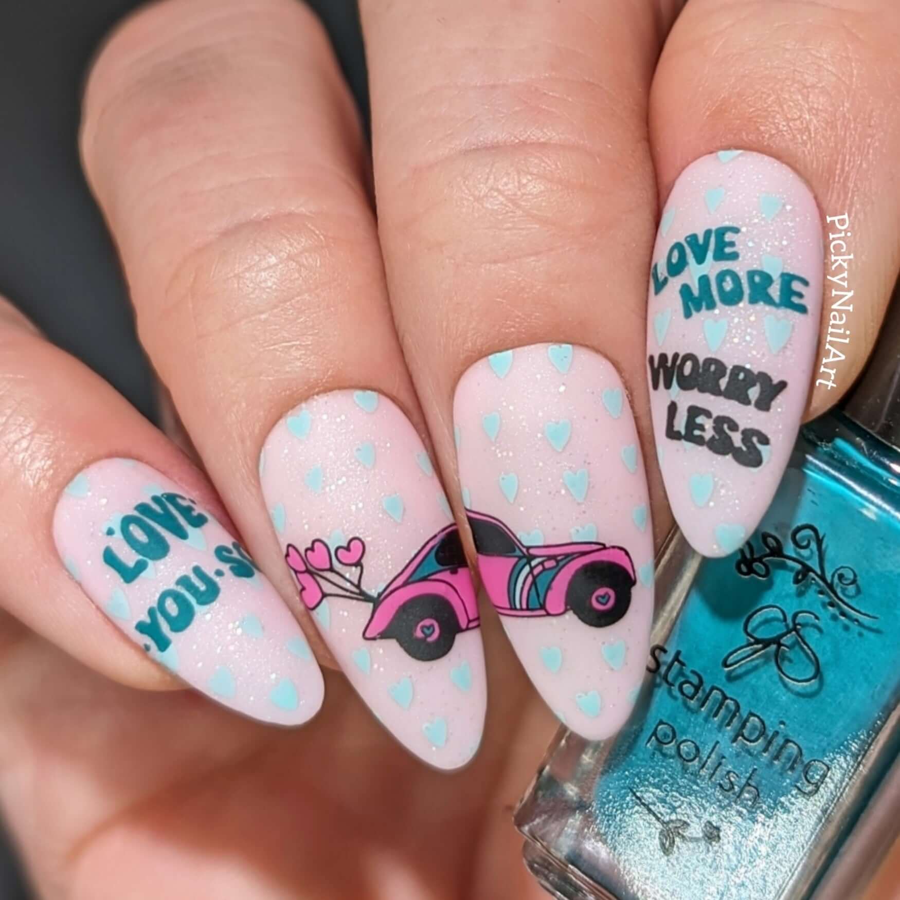 manicured-hand-with-layered-nail-art-designs-of-beetle-car-and-words-love-more-worry-less