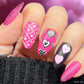 maniucred-hand-with-bright-nail-art-designs-of-hearts-with-patterns-on