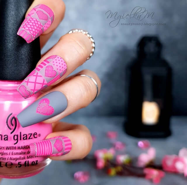 manicured-hand-with-stunning-patchwork-heart-nail-art-designs