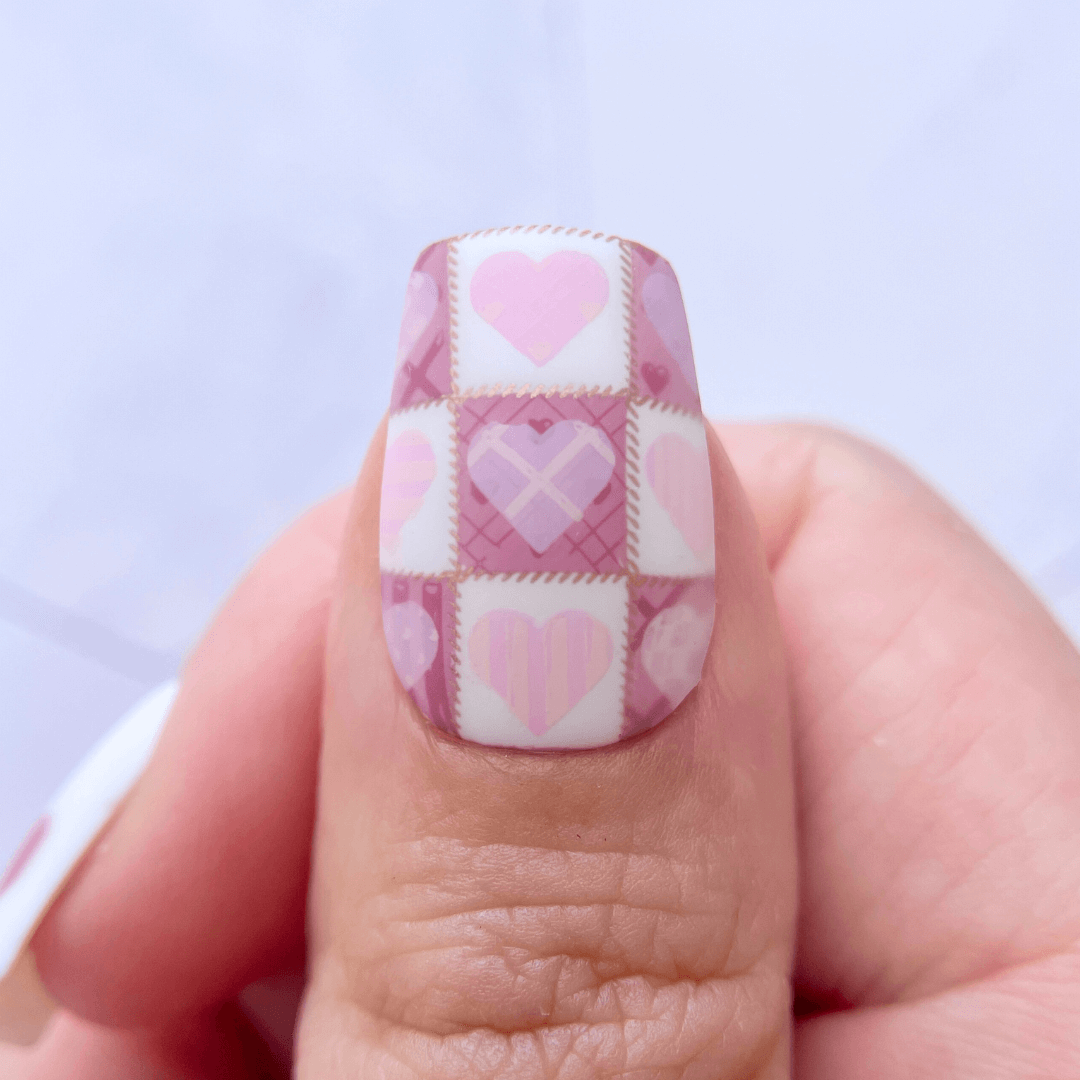 manicured-thumb-with-stunning-patchwork-heart-nail-art