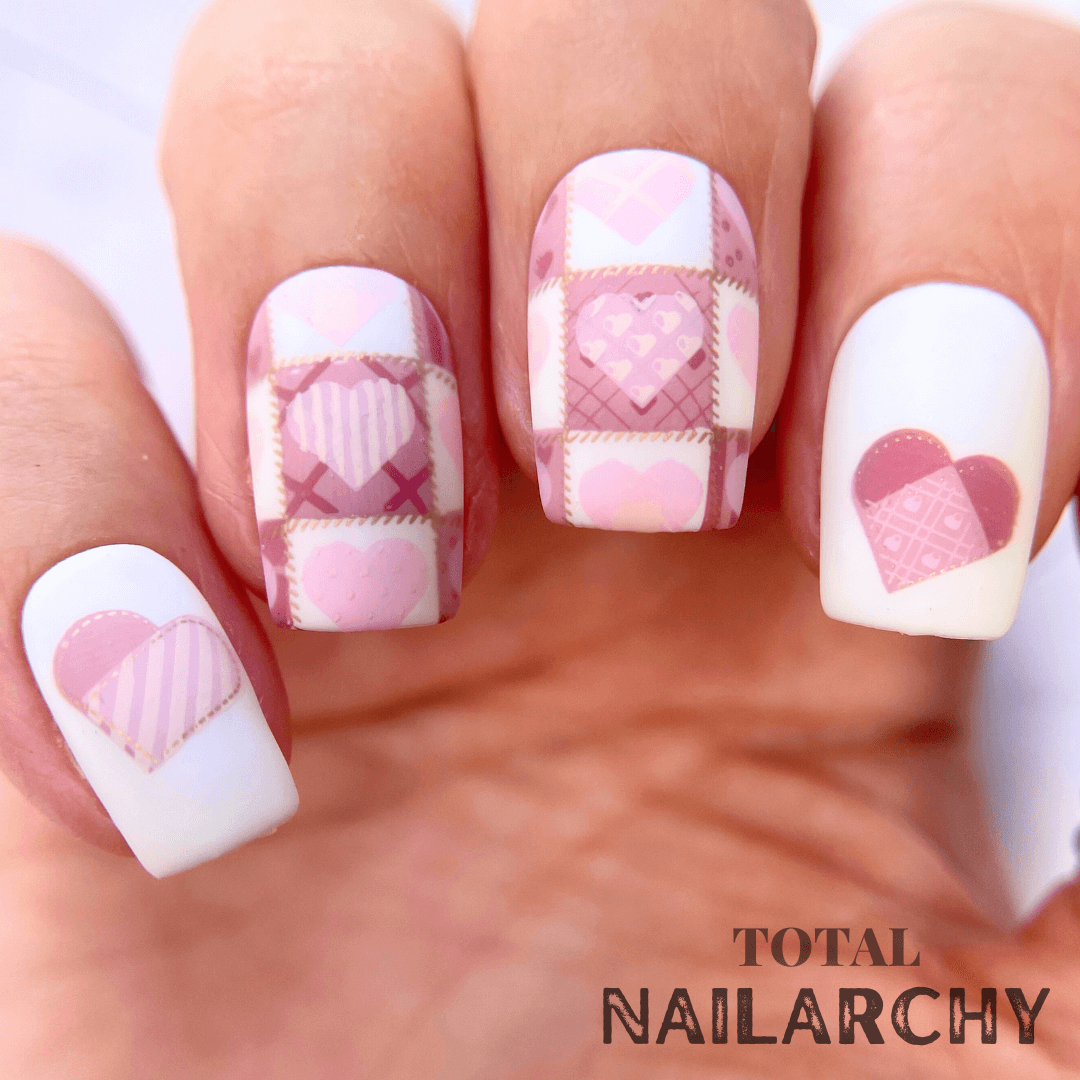 manicured-hand-with-stunning-patchwork-heart-nail-art