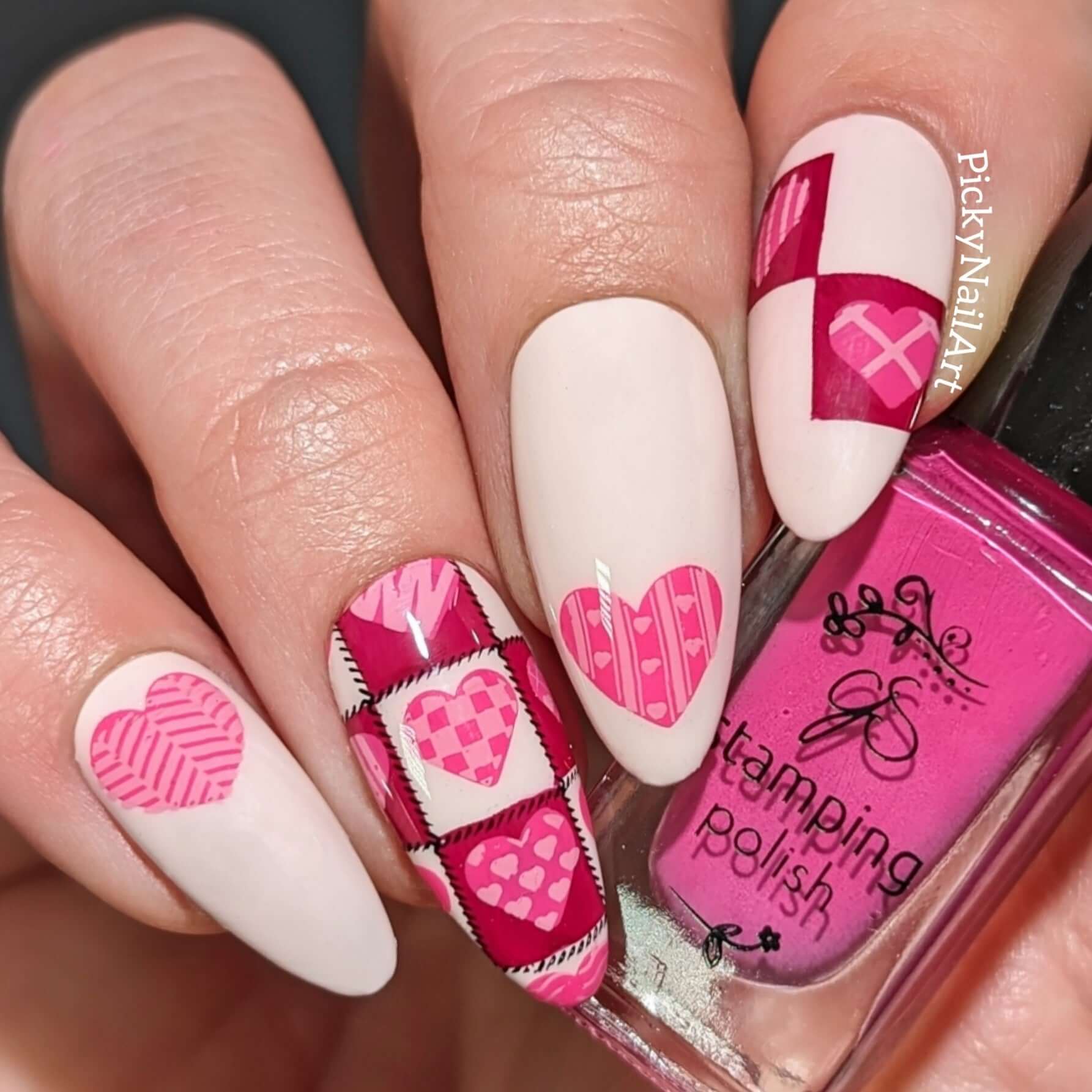 manicured-hand-with-stunning-patchwork-heart-nail-art-holding-a-stamping-polish-bottle