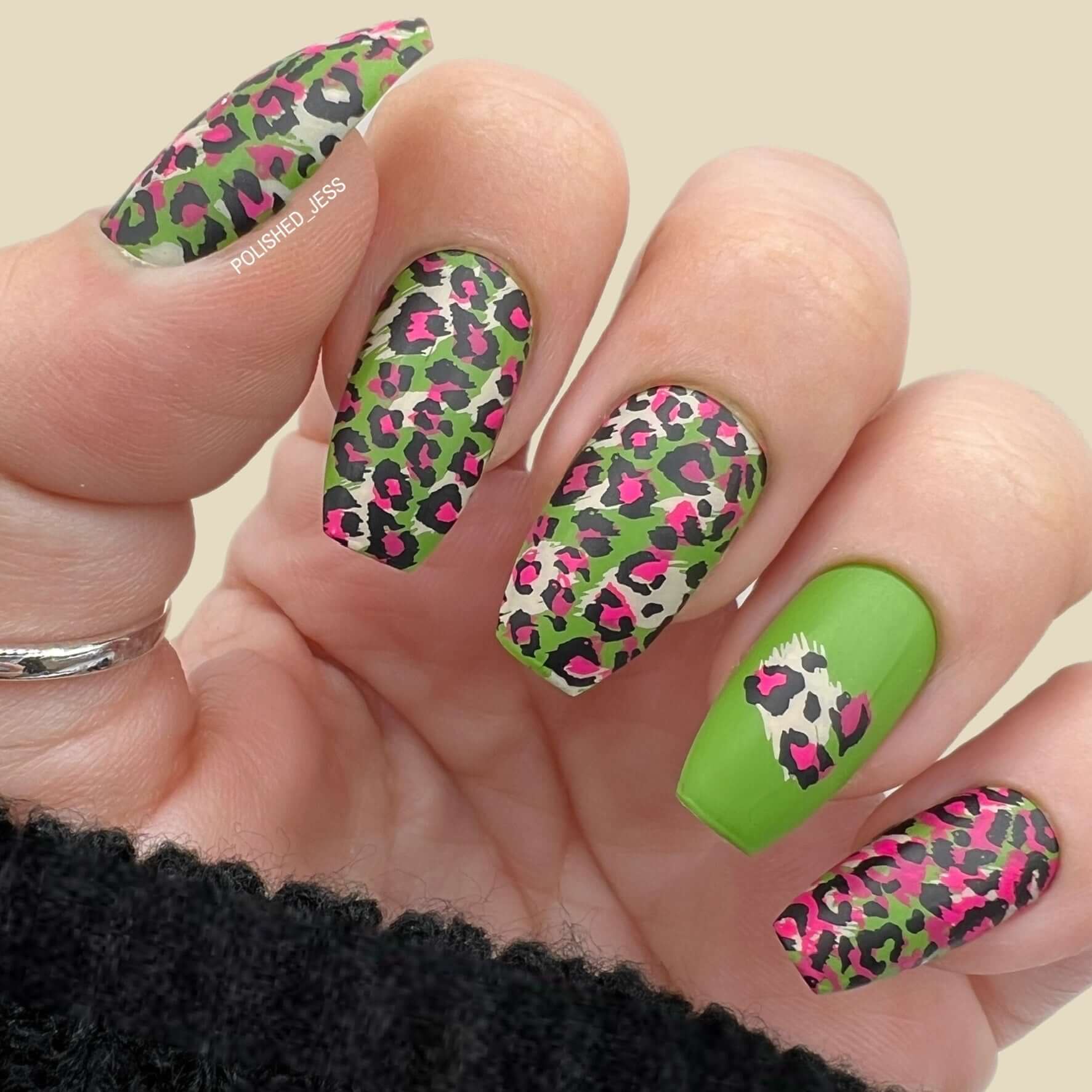 manicured-hand-with-full-coverage-animal-print-nail-art-designs