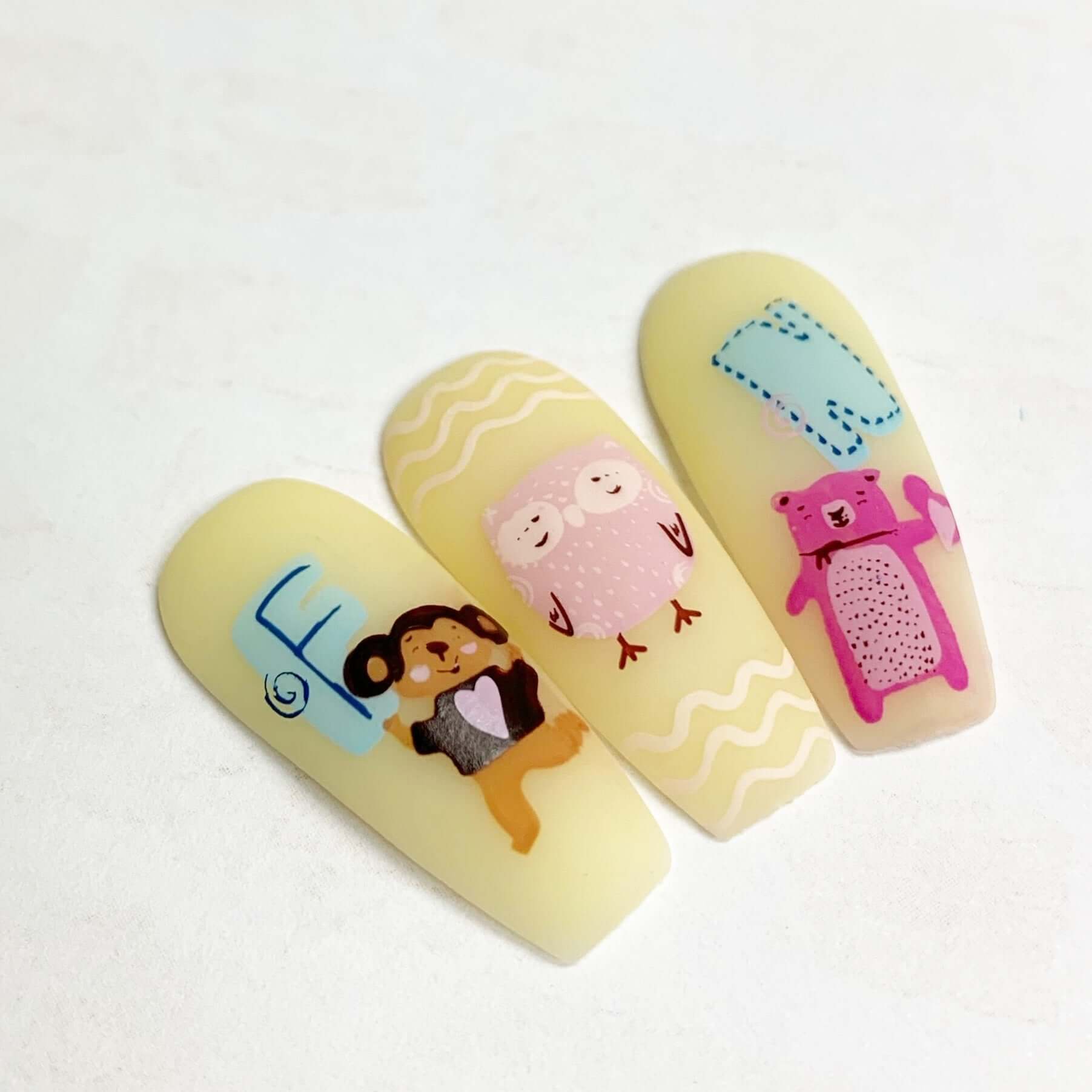 nail-tips-showing-nail-art-designs-of-woodland-animals-and-letters