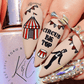 Manicure-with-nail-art-designs-of-a-circus-tent-bunting-and-a-ringmaster-the-words-circus-big-top