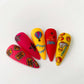 set-of-nail-tips-with-bright-colorful-circus-nail-art-designs-of-an-elephant-stars-and-circus-tickets