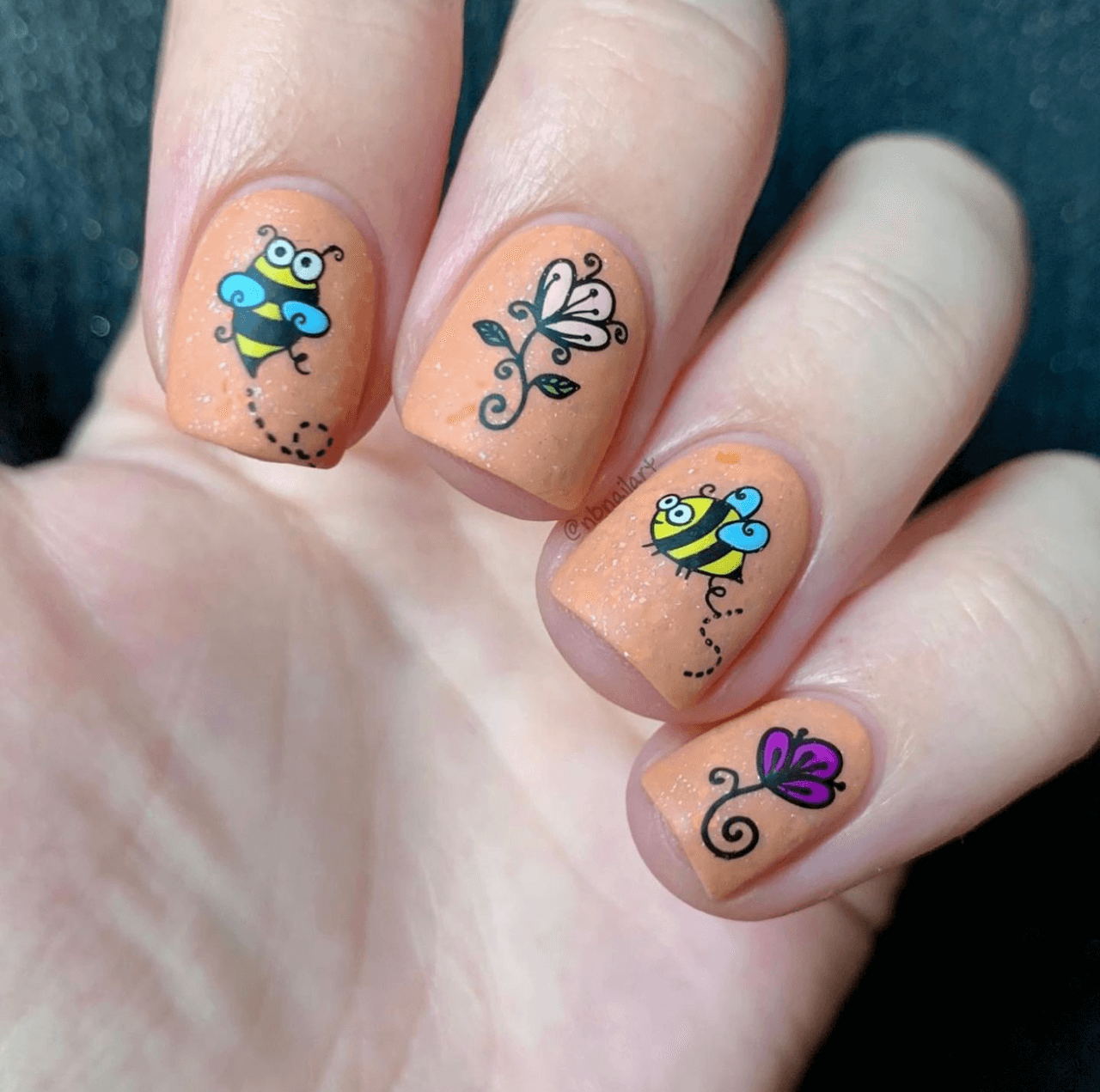 manicure-with-cute-nail-art-designs-of-cartoon-bees