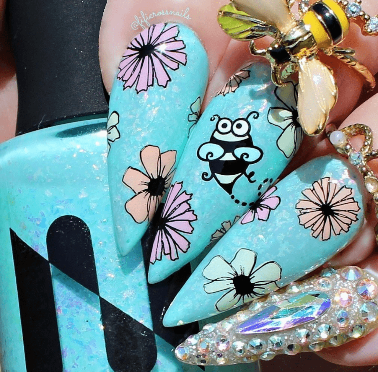 manicure-with-cute-nail-art-designs-of-a-bee-and-flowers