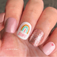 sparkly-manicure-with-a-nail-art-design-of-arches-and-hearts-with-the-words-boho