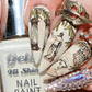 manicure-showing-nail-art-designs-of-greek-inspired-marble-statues-and-columns 