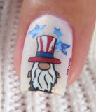 single-manicured-nail-showing-a-nail-art-design-of-a-gnome-wearing-a-usa-hat