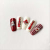manicured-nail-tips-showing-nail-art-designs-in-red-and-white-of-maple-leaves-gnome-and-nail-art-words