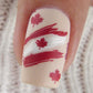 single-manicured-nail-tip-showing-nail-art-design-of-canadian-flag