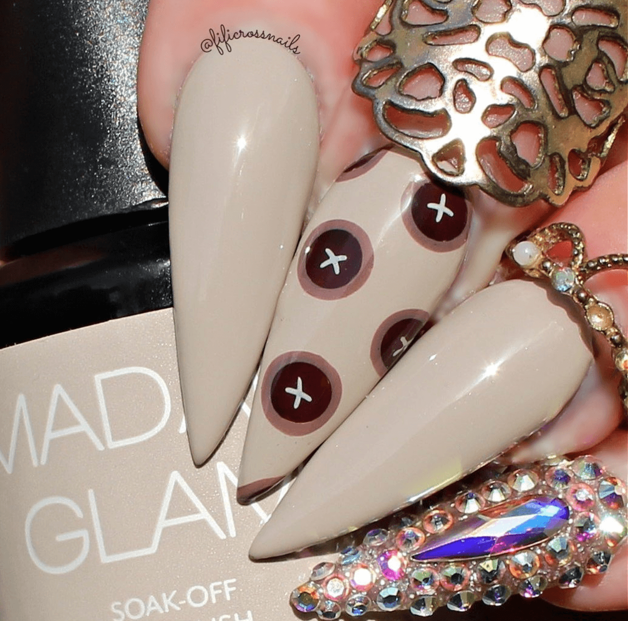 manicure-showing-nail-art-design-of-buttons