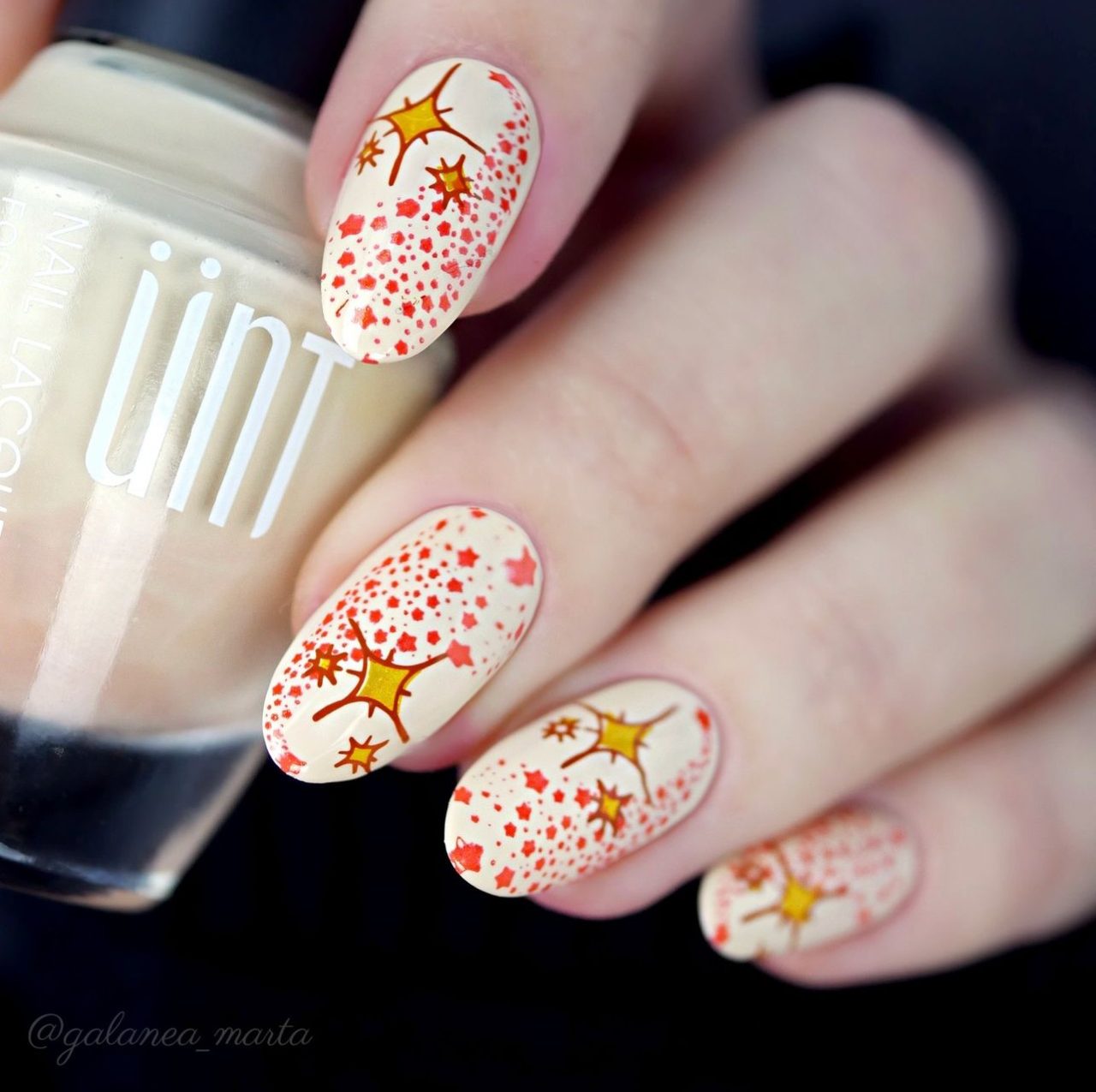gorgeous-manicured-hand-showing-nail-art-design-of-shinning-stars