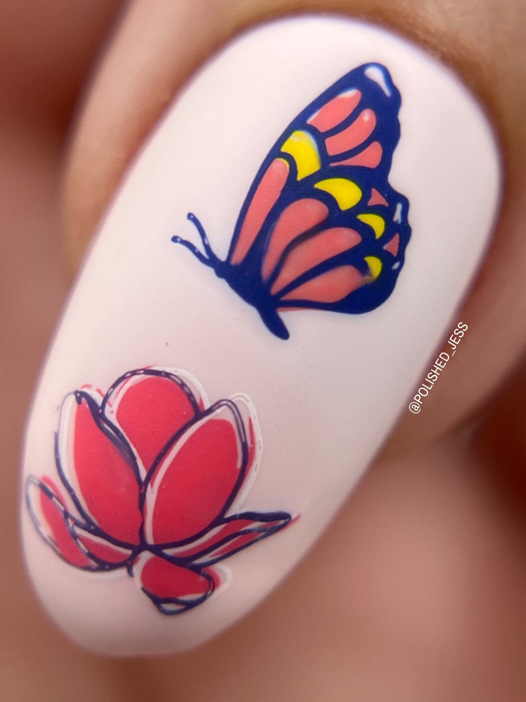single-nail-with-layered-stamping-design-of-a-butterfly-and-a-flower