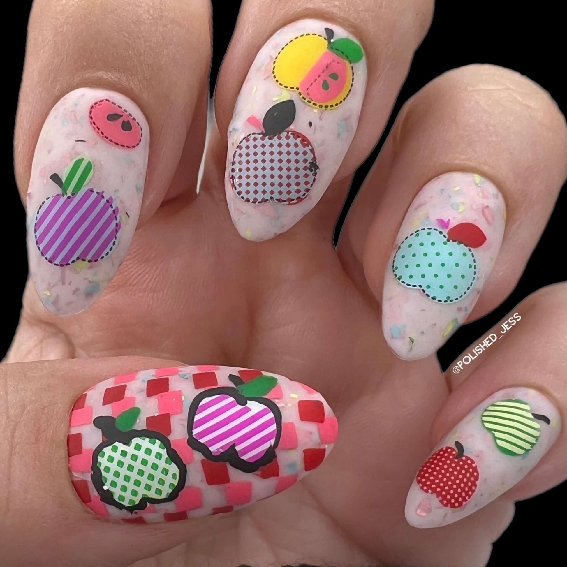 beautiful-manicure-showing-nail-art-designs-of-assorted-patchwork-apples