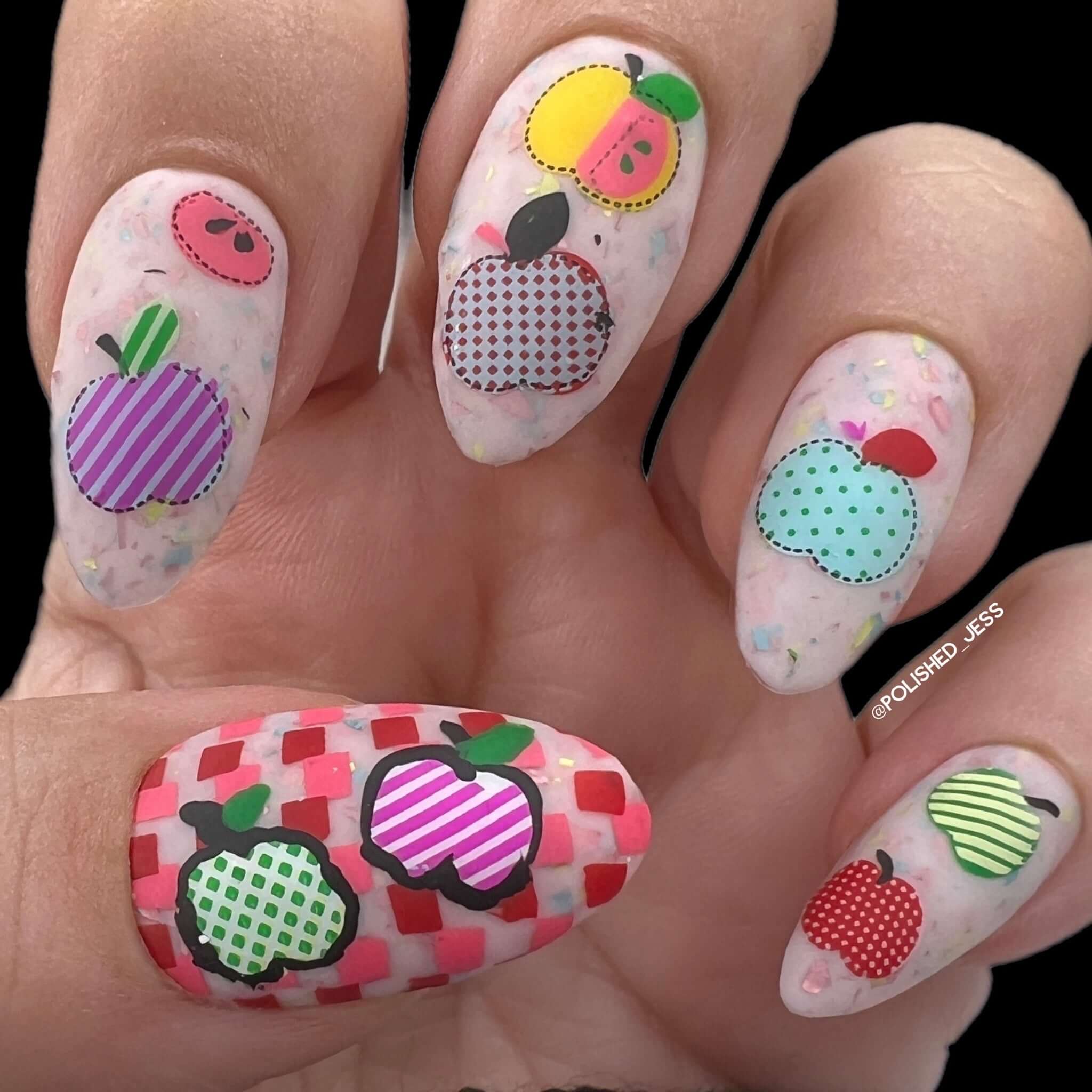 beautiful-manicure-showing-nail-art-designs-of-assorted-patchwork-apples