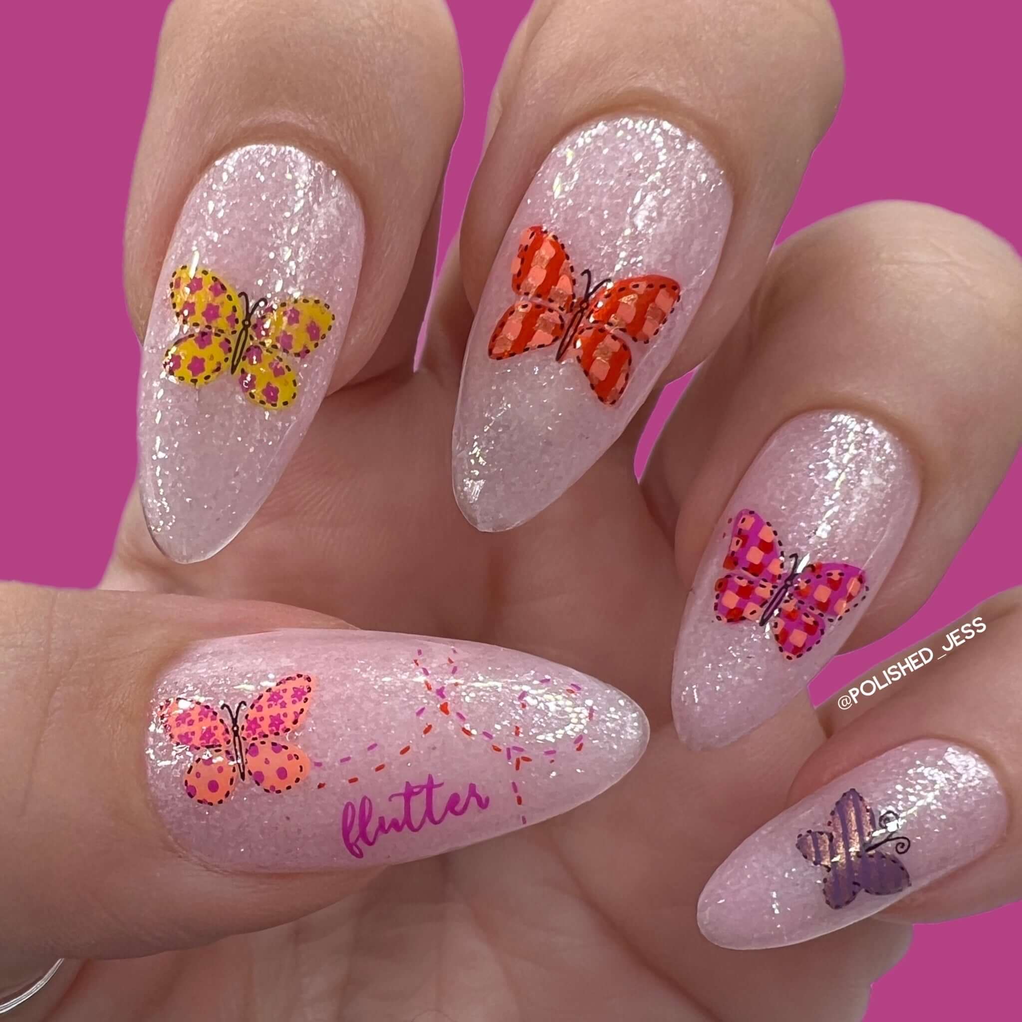 stunning-glittery-manicure-showing-nail-art-designs-of-butterflies