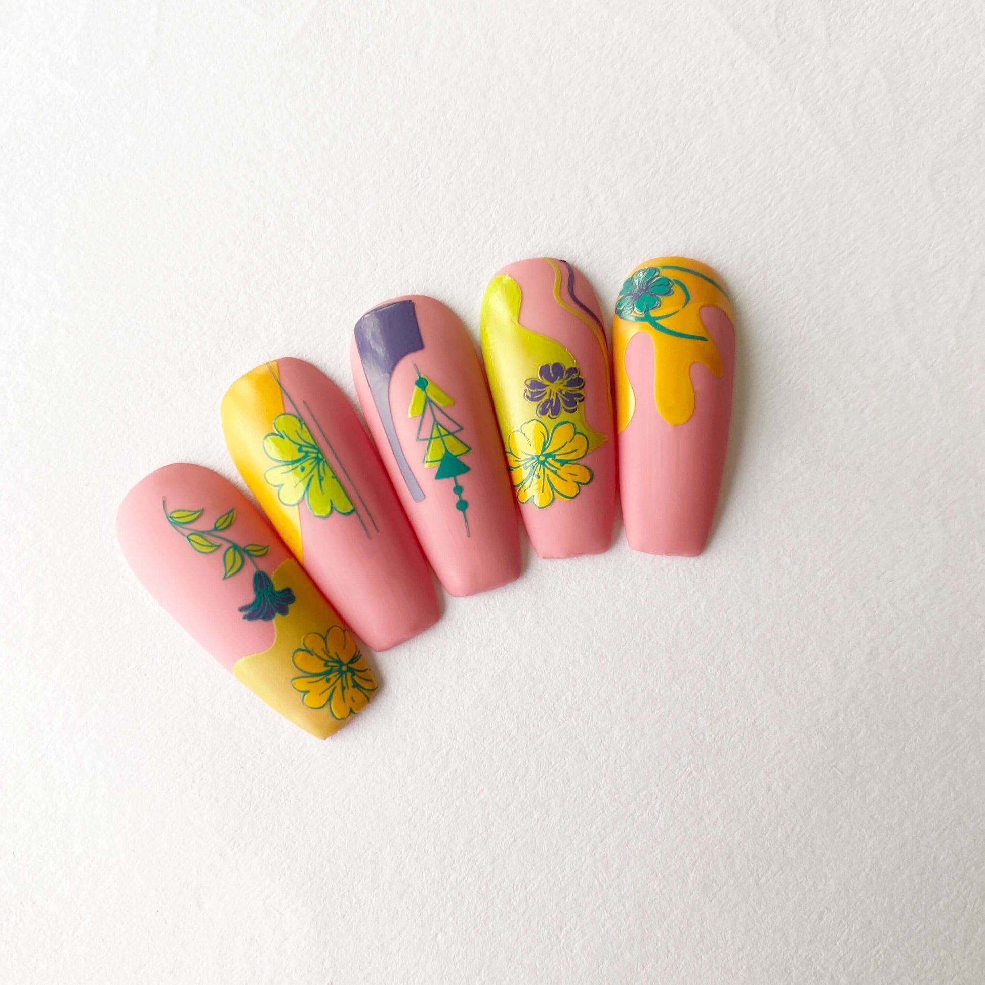 nail-tips-showing-beautiful-manicured-nail-art-designs-of-flowers-and-geometric-shapes