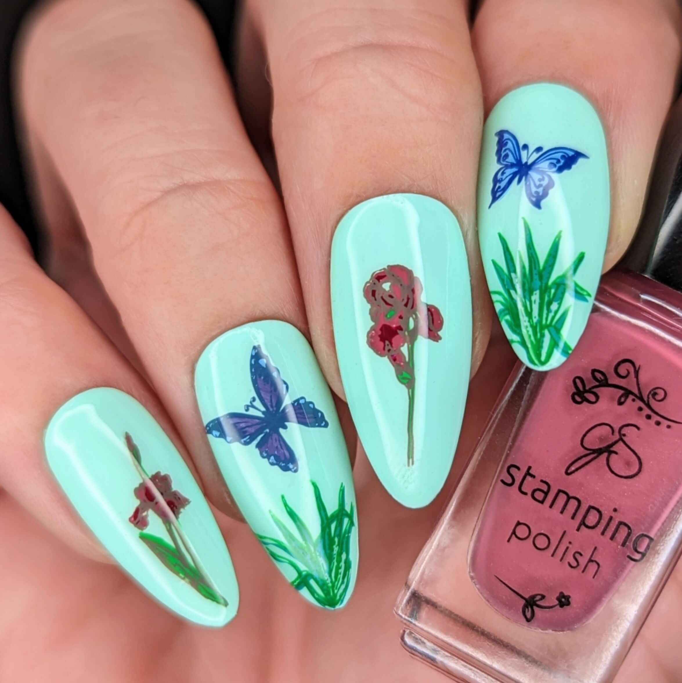 bold-manicure-with-nail-art-designs-of-butterflies-grass-and-flowers