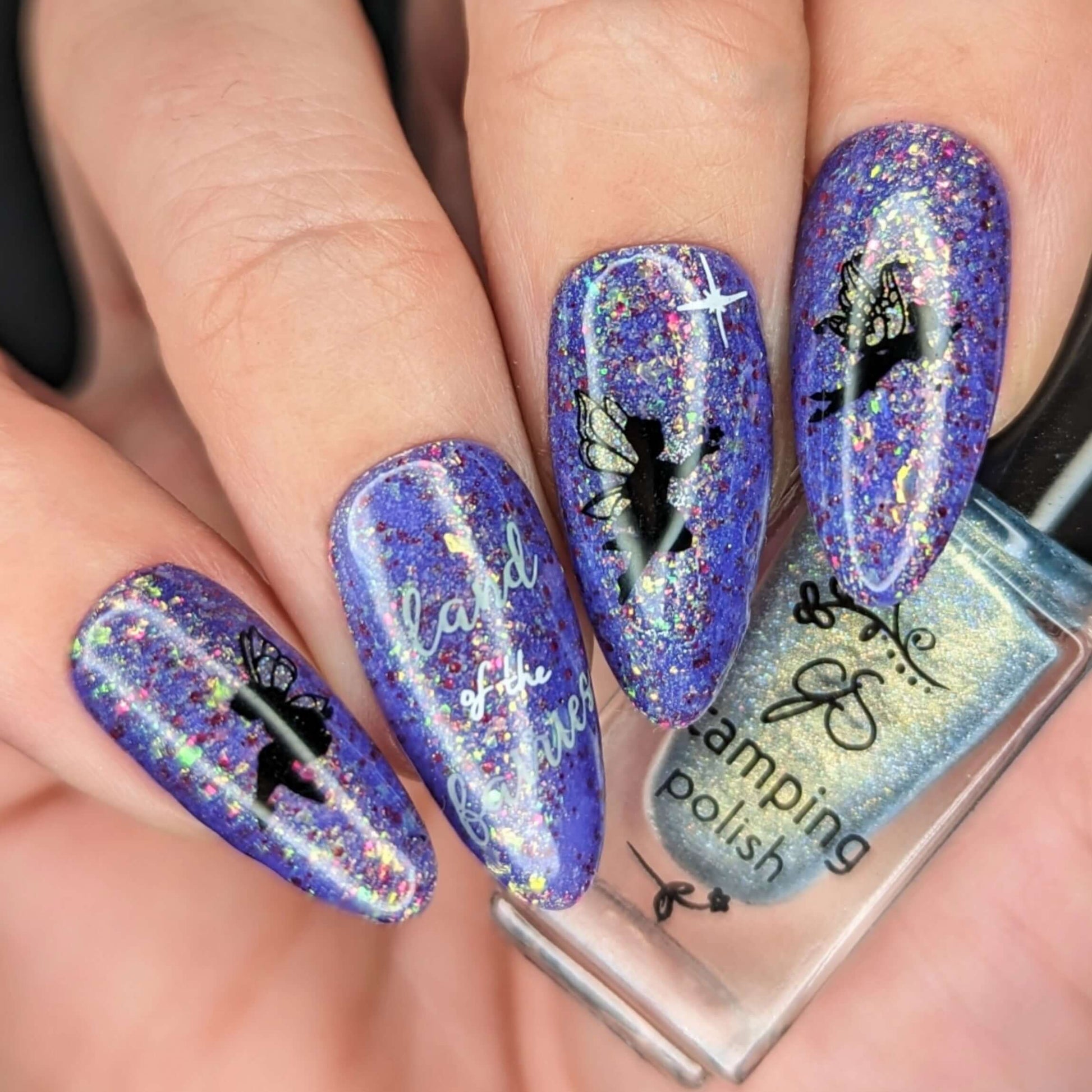 bright-purple-manicure-showing-nail-art-designs-of-fairy-silhouettes