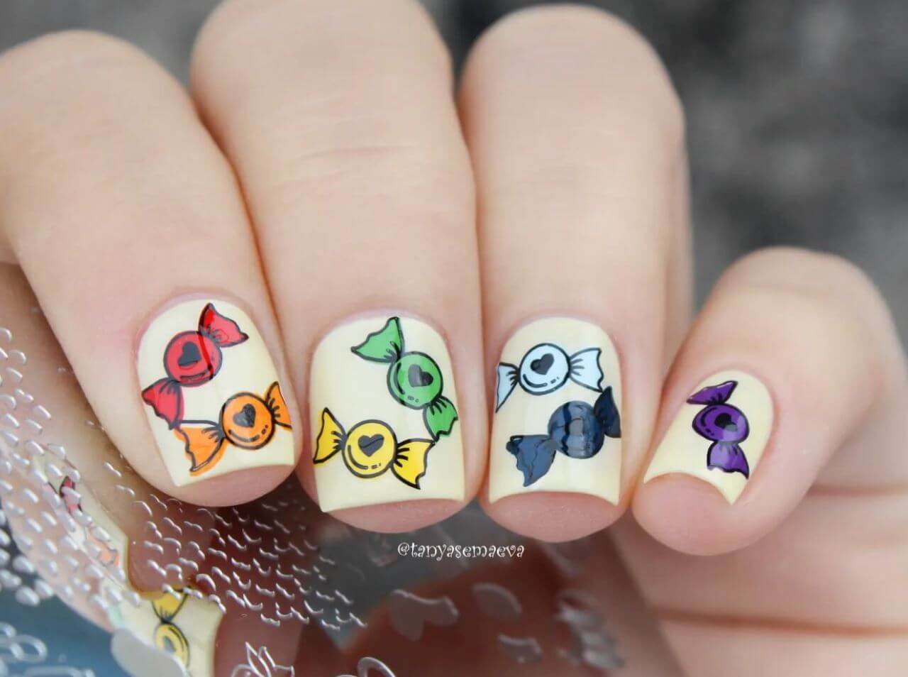 bright-manicure-with-layered-nail-art-designs-of-valentines-candy