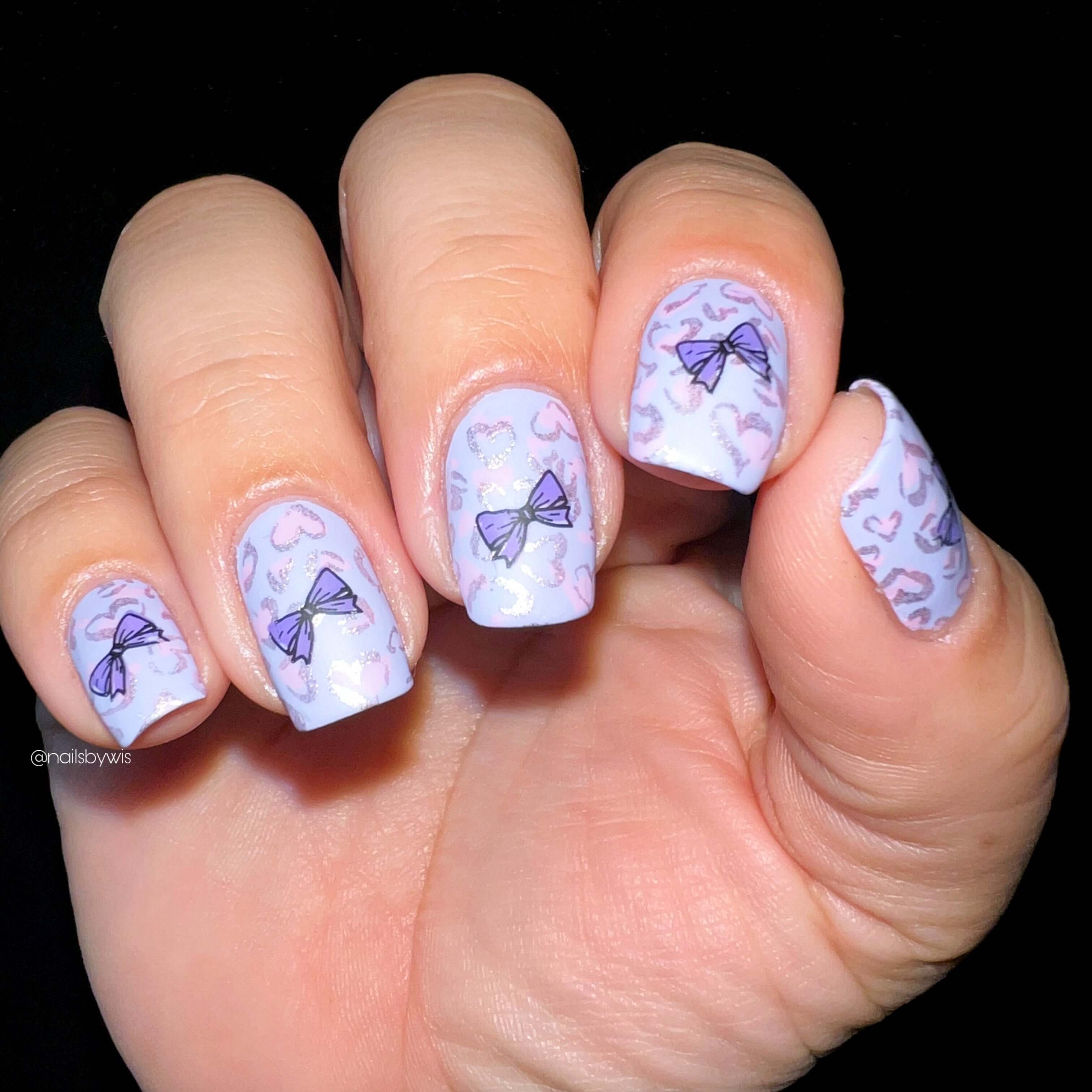 stunning-manicure-with-nail-art-of-heart-animal-print-and-bows
