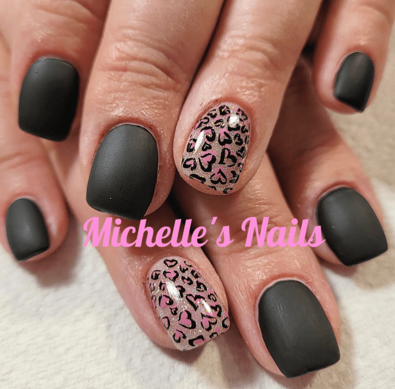 bold-manicure-with-nail-art-designs-of-animal-heart-print