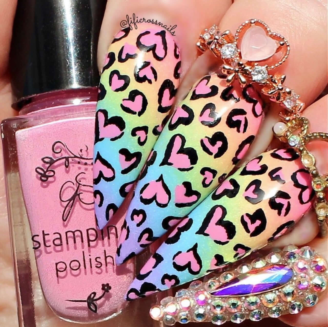 manicured-hand-with-full-coverage-nail-art-designsof-heart-animal-print